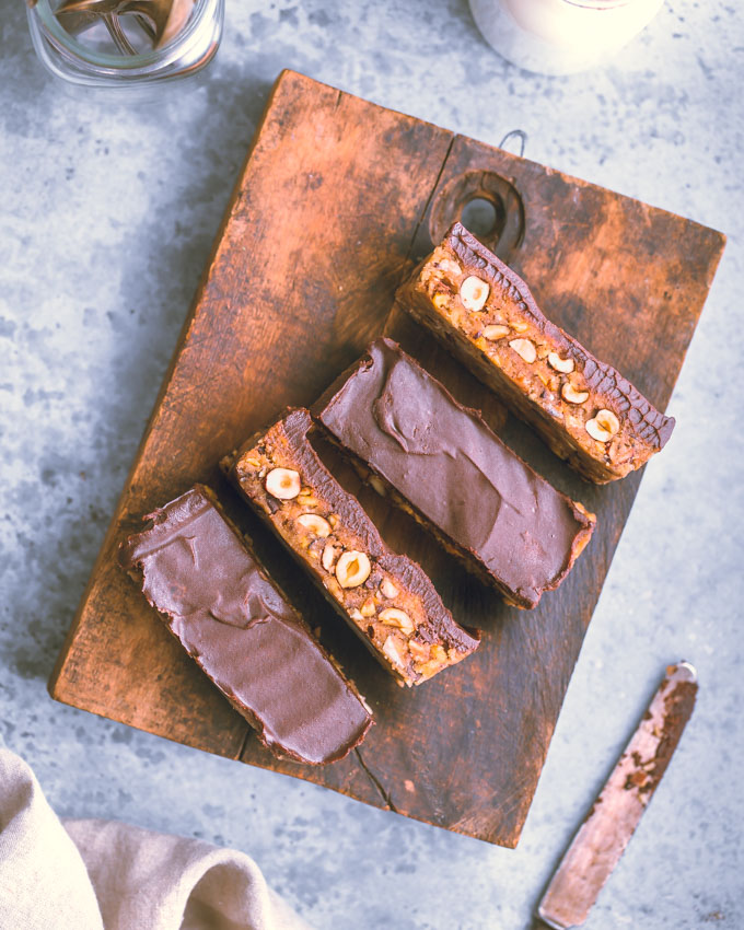 4 Cookie Dough Protein Bars on a cutting board