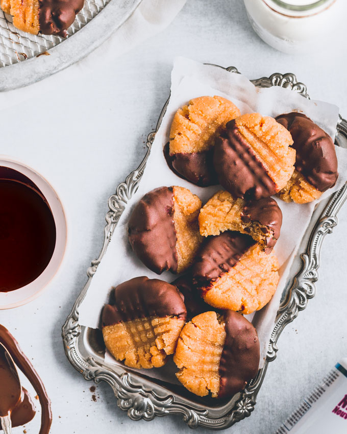 Peanut butter collagen protein cookies on a silver tray
