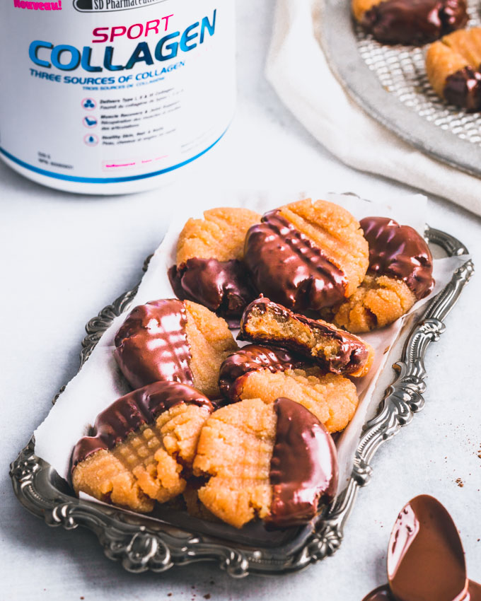 Peanut butter collagen protein cookies on a silver tray