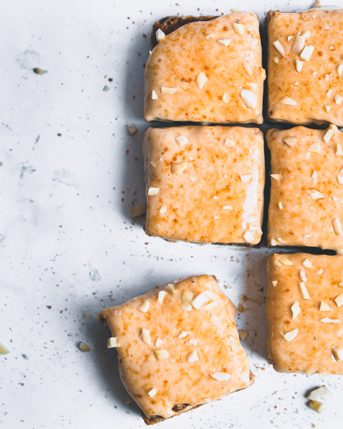 Caramel oatmeal protein bars on a white background