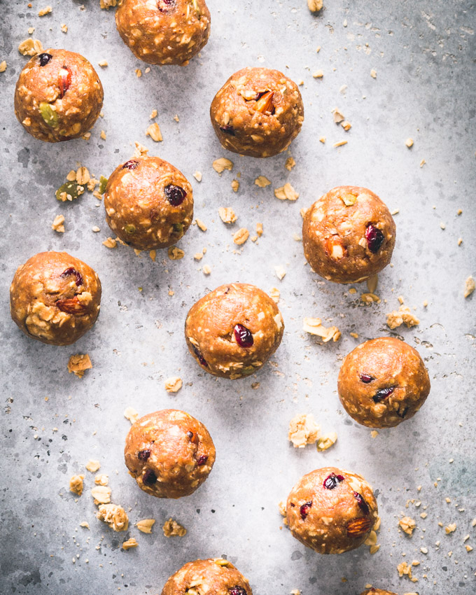 Cranberry Almond Granola Protein Balls on a blue background