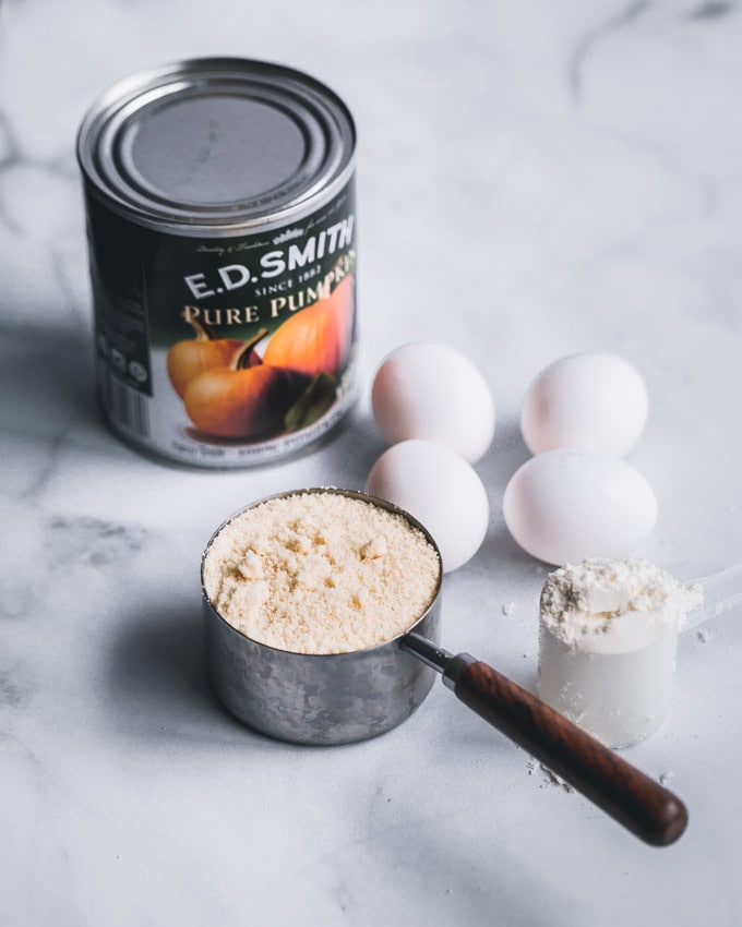 A can of pumpkin puree, eggs, almond flour, whey protein powder