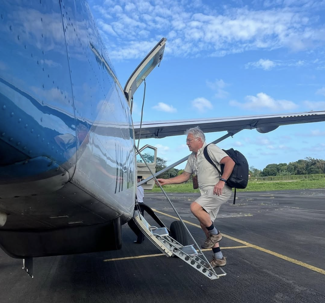 Passenger with Carry On Boarding Plane