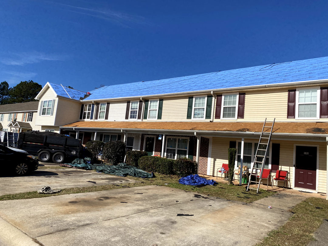 Wages Goldstar Roofing &amp; Gutters Logo