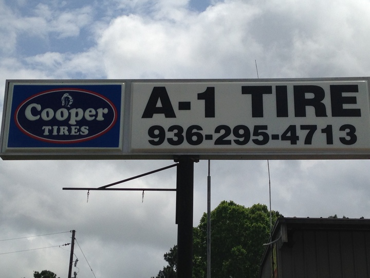 A-1 Tire &amp; Feed/Ellis D Walker Trucking Logo