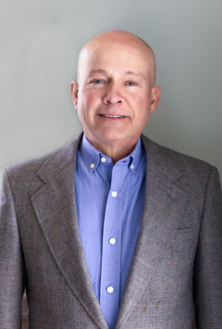 Dr. John M. McCraw, DMD Logo