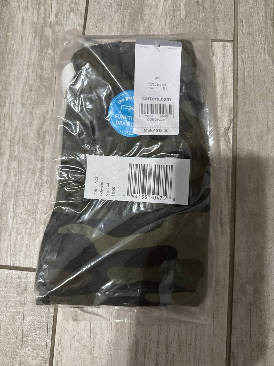 Calça camuflada Carter’s