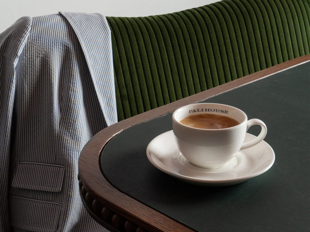 palihouse west hollywood - Coffee and saucer on edge of table. Jacket strewn over chair.