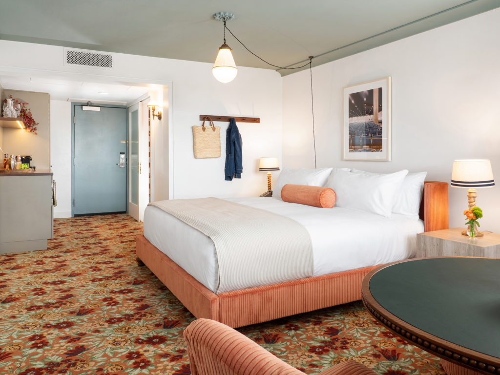 palihouse west hollywood - wide-angle room shot of seating area and bed area
