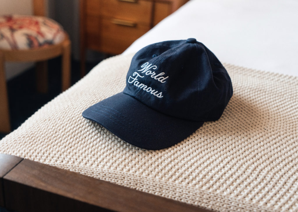 Palihotel San Diego - branded world famous hat on edge of bed