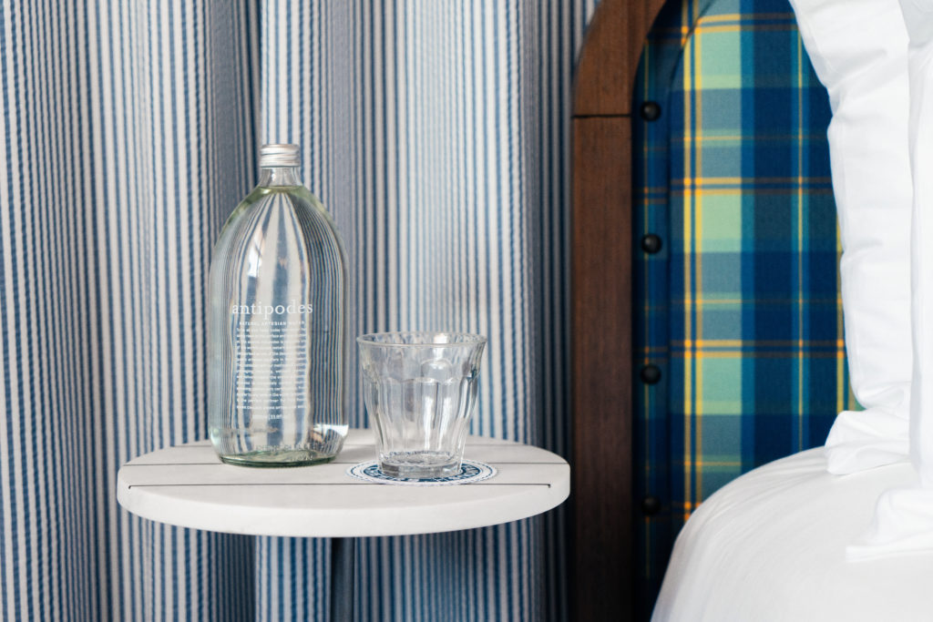 Palihotel San Diego - bedside table with water bottle and glass