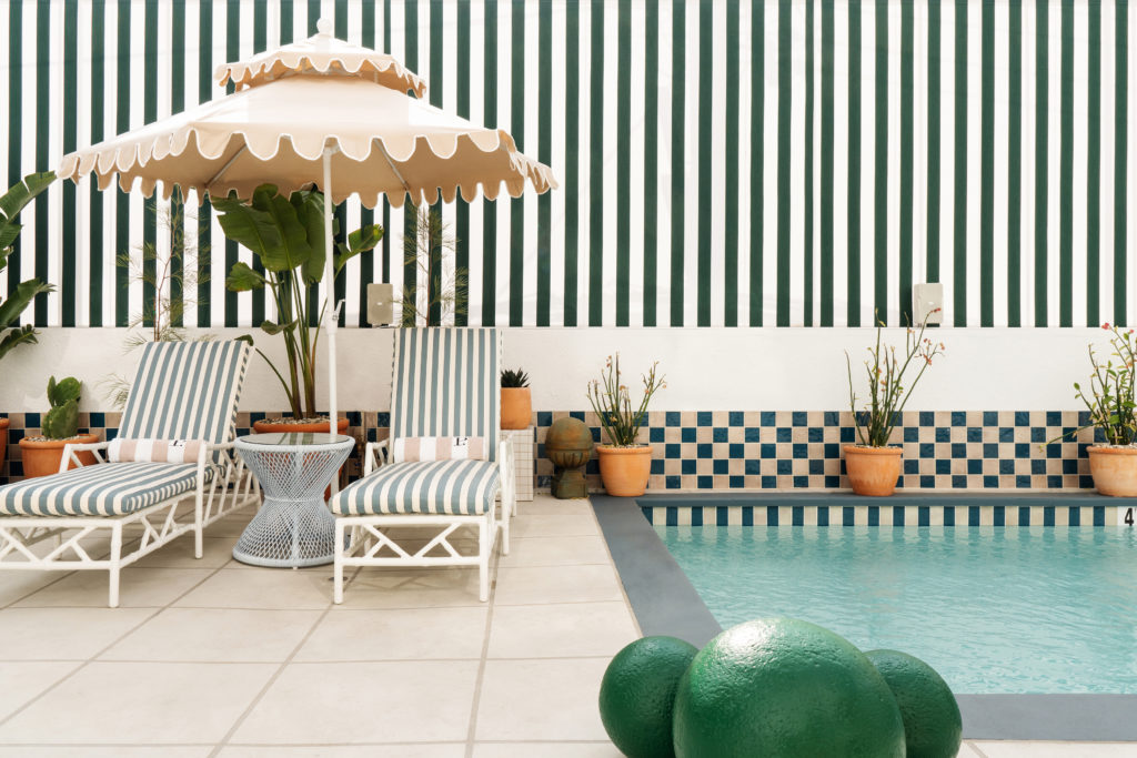 Palihouse West Hollywood - pool area with lounges and umbrella