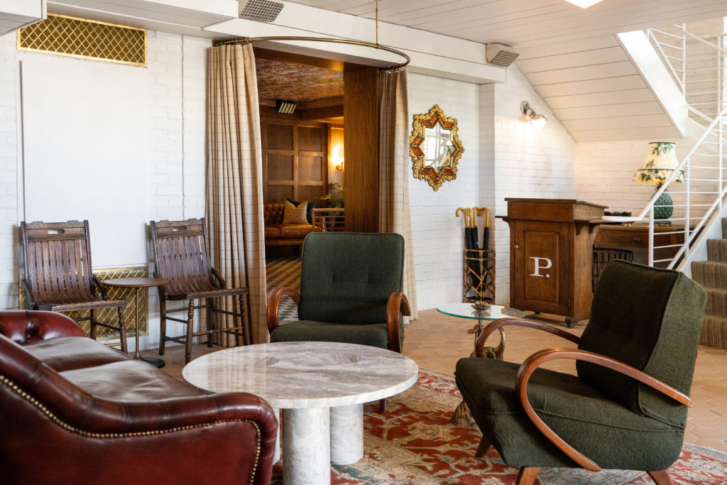 Palihouse West Hollywood - lobby lounge, seating, area with tables, chairs, and couches, showing stairs going up