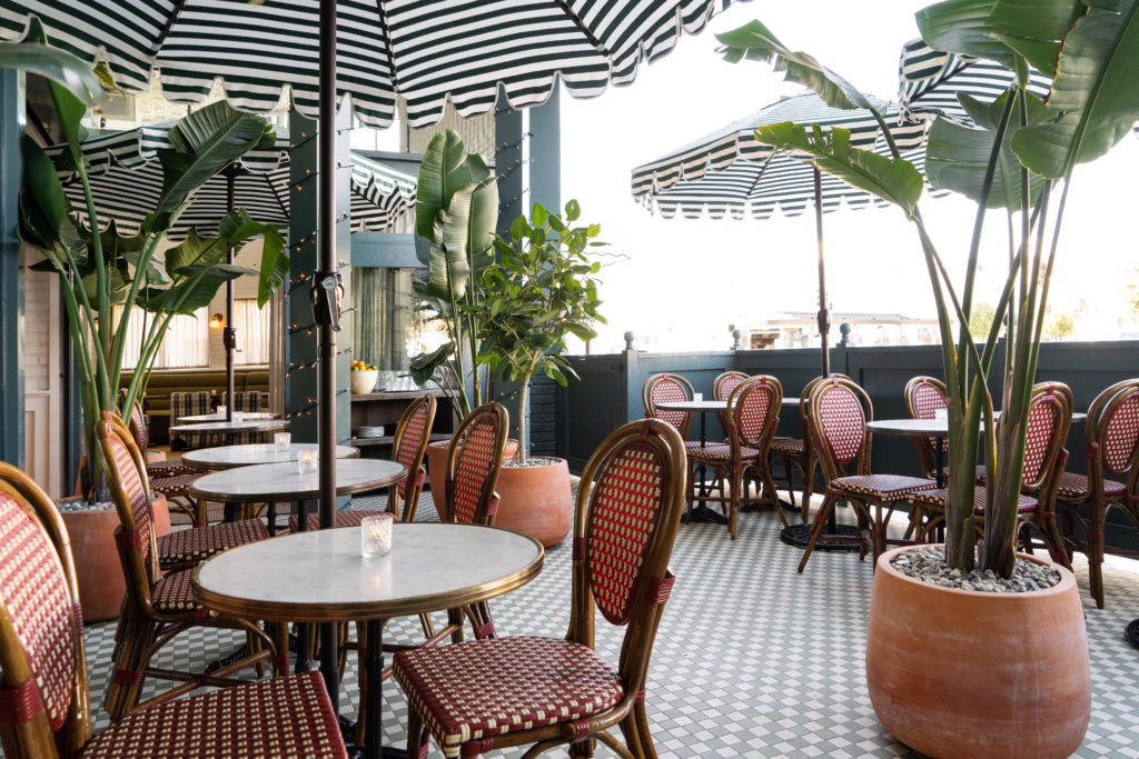 Palihouse West Hollywood - lobby, lounge, patio with chairs and tables and umbrellas and plants