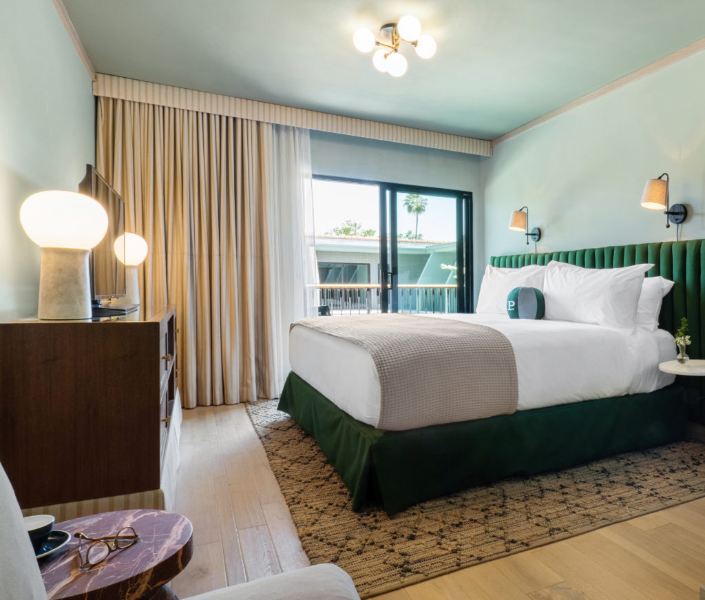 Palihotel Hollywood guestroom with bed, night stand, credenza and balcony