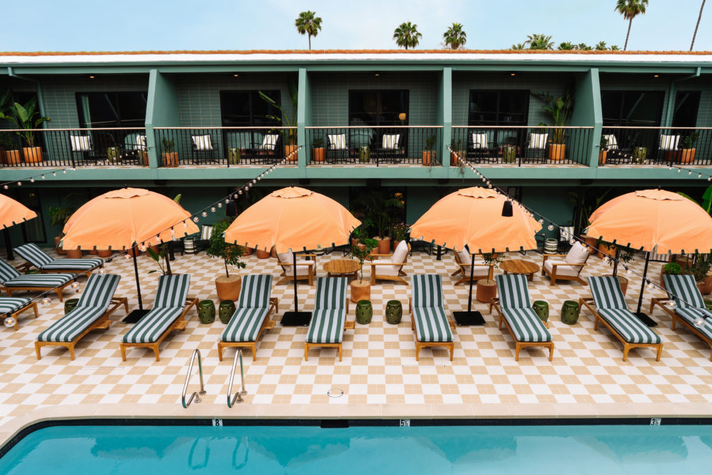 Palihotel Hollywood - arial of pool area, seating, umbrellas, balconies