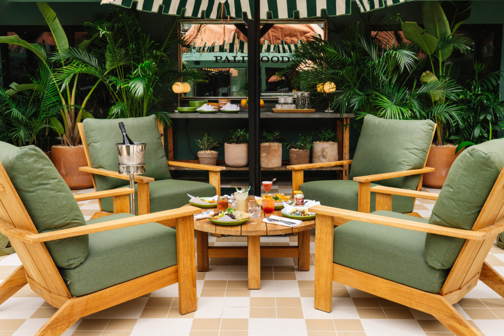 Palihotel Hollywood - pool seating area with cocktails and food