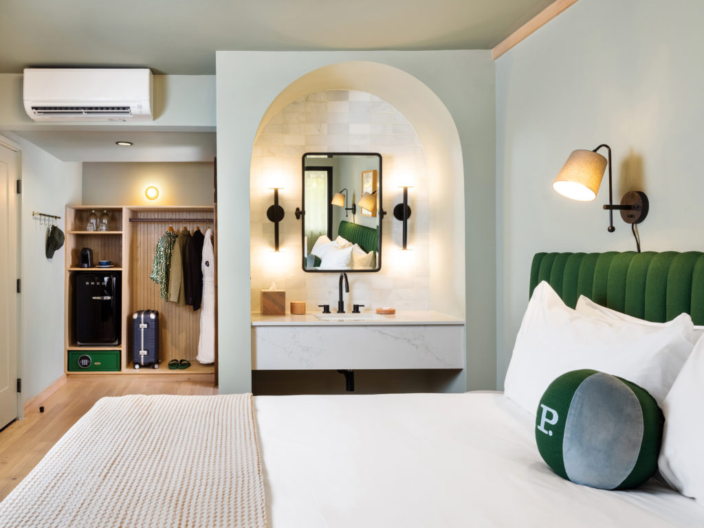 Palihotel Hollywood - wide room shot of bed, vanity, open concept closet