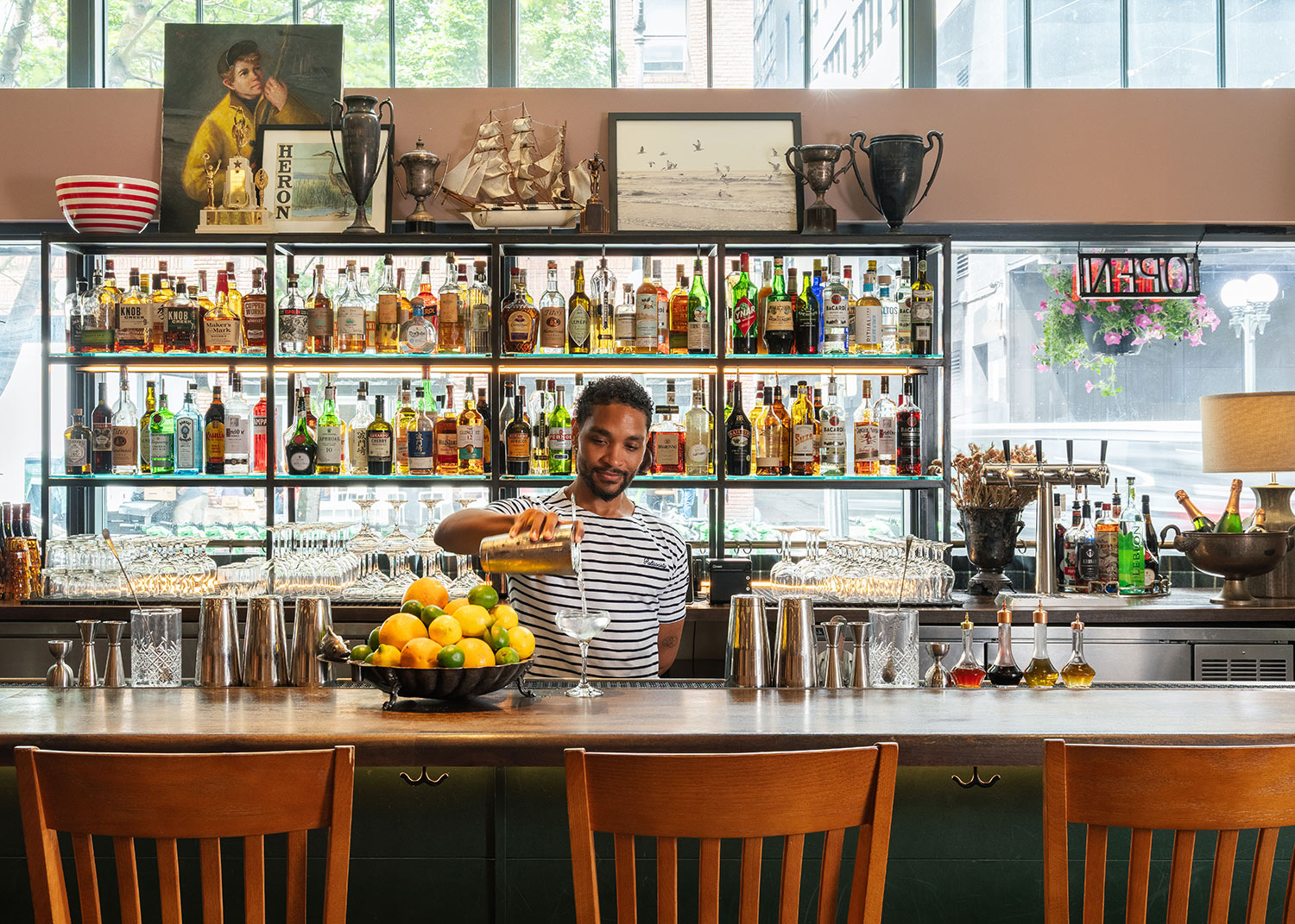 bar tender making drink at bar