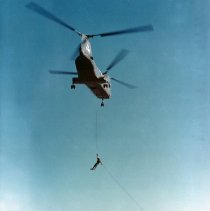Commandos rappelling from a CH46 Sea Knight