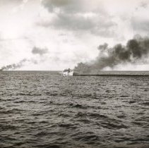 unknown ships burning at sea