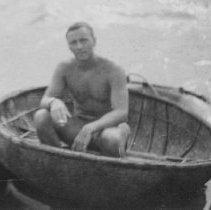 unidentified sailor in very small boat