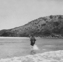 sailor with weapon in knee deep water