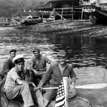 Four sailors on rubber raft