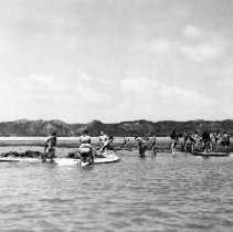 Sailors with rafts in shallow water, April 2, 1945 Okinawa