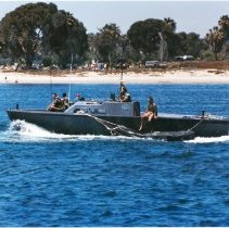 inflatable boat being towed by a utility boat