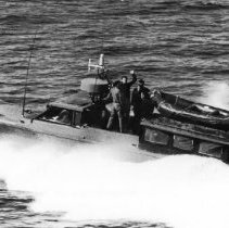 B&W photo of unknown sailors on boat.