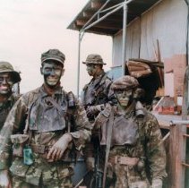 5 SEALS in Camo and grease paint with weapons