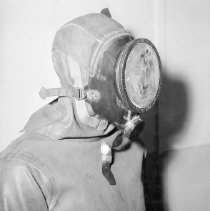 swimmer with Pirelli rubber dry suit and face mask