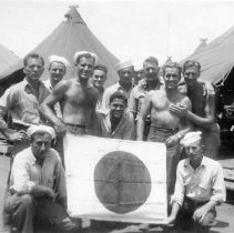 UDT 9 with Japanese Flag in front of tent