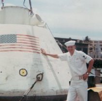 Photo of William Allen with boilerplate" Apollo command module