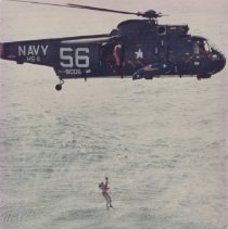 Astronaut being picked up by helocopter