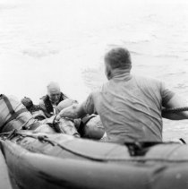 Divers coming up on rubber raft