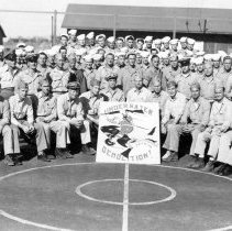 UDT 10 group shot with sign in Oceanside, CA.