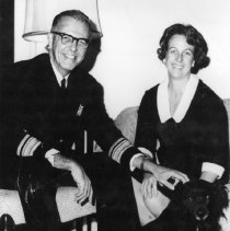 Draper Kauffman poses with woman and dog