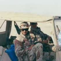 Army Rangers stop and pose in jeep