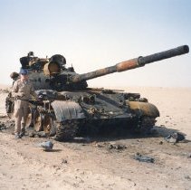 burned out Russian tank with unknown man