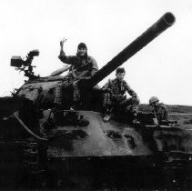 Kiet Van Nguyen on a tank