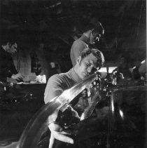 Dennis Sprenkle inspecting the blade of a Navy bobsled.