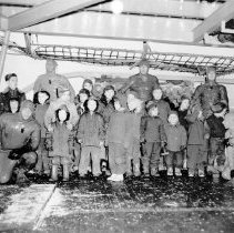 UDT members posing with Canadian school children