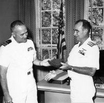 Maxwell Harris (S&R) receiving award plaqu