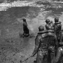 Trainees covered in mud