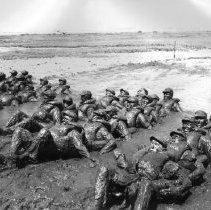 Trainees covered in mud