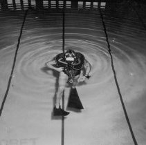 Adjusting needle valve on oxygen supply.