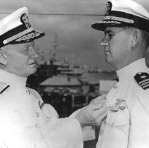 LT COMDR W. B. Perkins being award a medal
