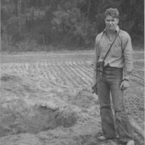 Loran Barbour in training standing in field